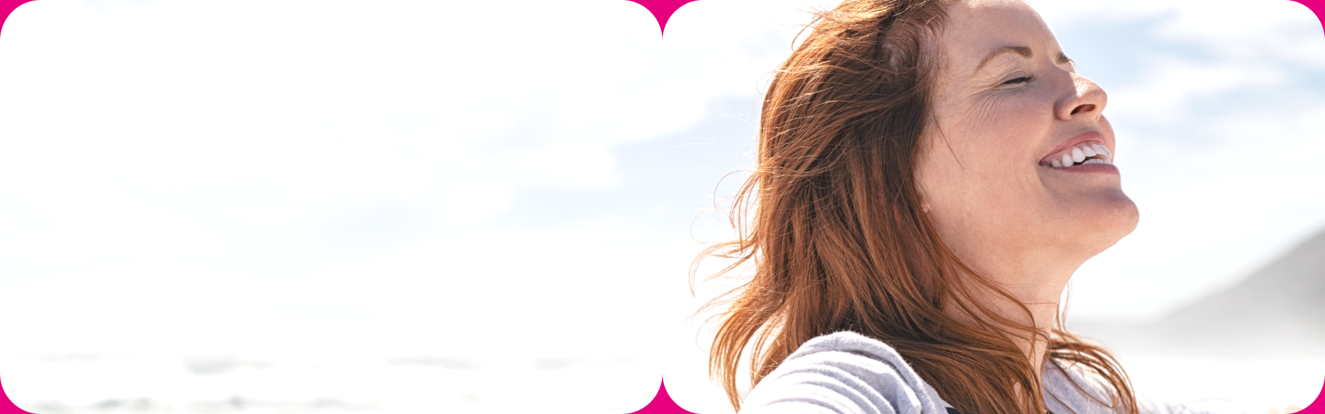 Woman smiling, with the wind blowing in her face